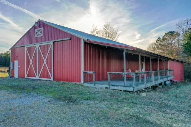 view of outbuilding with a yard