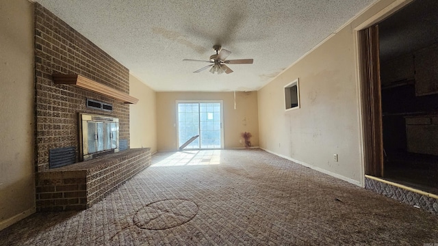 10085 James Dr, Havana, AR 72842 - unfurnished living room featuring ceiling fan, a fireplace, carpet, and a textured ceiling