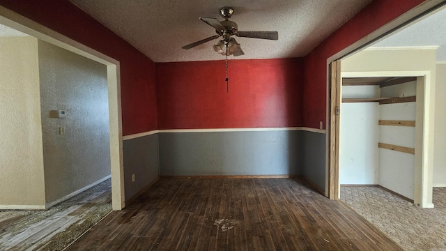 10085 James Dr, Havana, AR 72842 - unfurnished room with a textured ceiling, dark hardwood / wood-style flooring, and ceiling fan