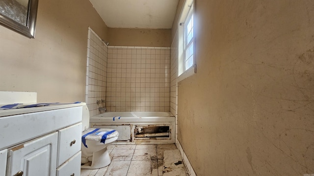 10085 James Dr, Havana, AR 72842 - full bathroom with vanity, toilet, and tiled shower / bath combo