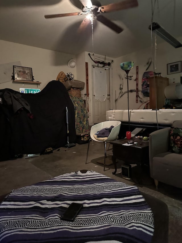 interior space with concrete floors and ceiling fan