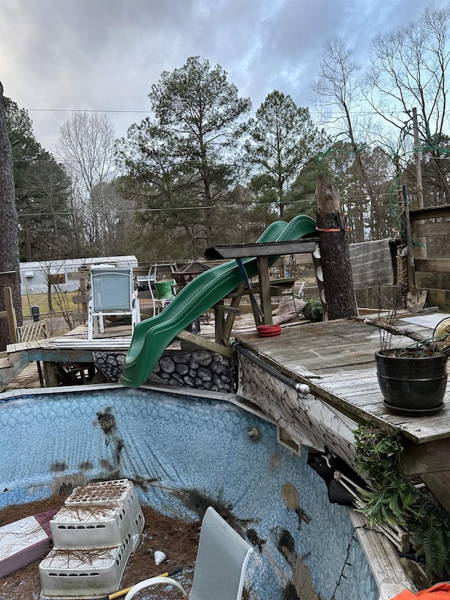 view of pool featuring a playground