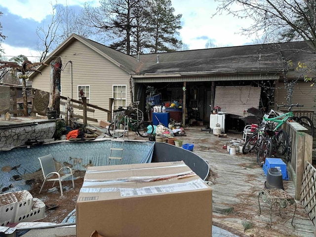 rear view of house featuring a deck