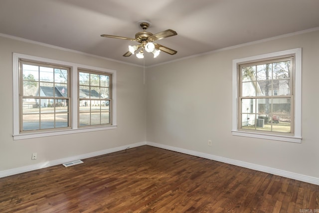 spare room with ceiling fan, dark hardwood / wood-style flooring, and ornamental molding