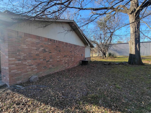 view of side of home featuring cooling unit