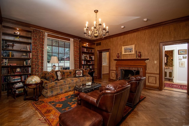 living room featuring built in features, a fireplace, parquet flooring, and a chandelier