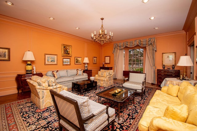 living room with hardwood / wood-style flooring, crown molding, and a chandelier