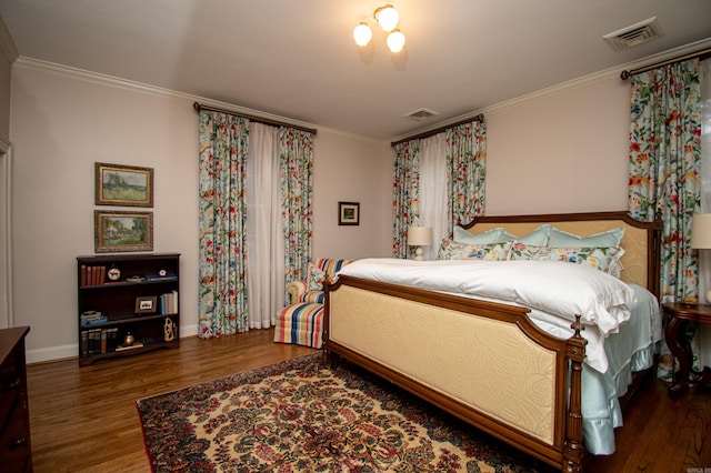 bedroom with crown molding and dark wood-type flooring