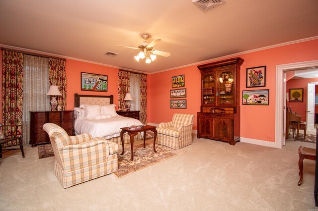 living room with ornamental molding, carpet floors, and ceiling fan