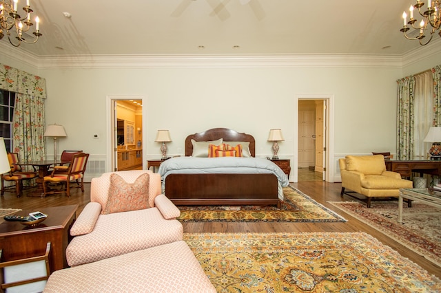 bedroom with ceiling fan with notable chandelier, crown molding, and hardwood / wood-style floors