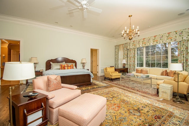 bedroom featuring wood-type flooring, crown molding, and ceiling fan with notable chandelier