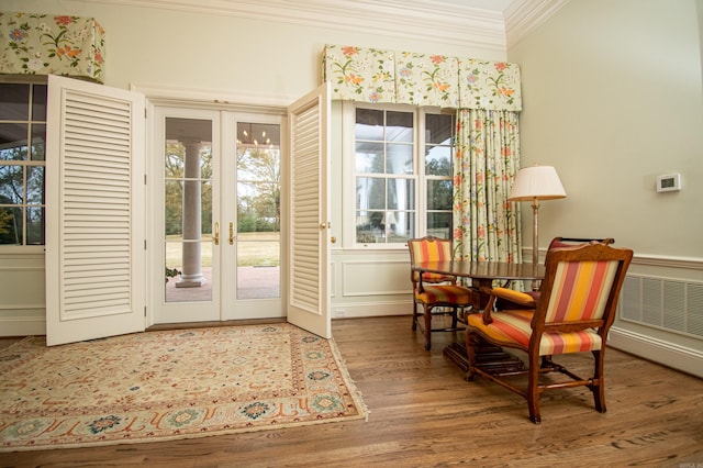 interior space with crown molding, hardwood / wood-style floors, a wealth of natural light, and french doors