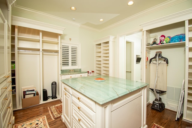 spacious closet with dark hardwood / wood-style floors