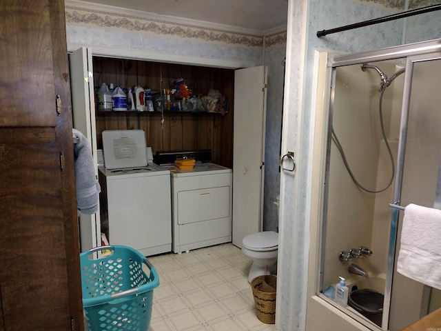 bathroom with tile flooring, shower / bath combination with glass door, independent washer and dryer, toilet, and crown molding