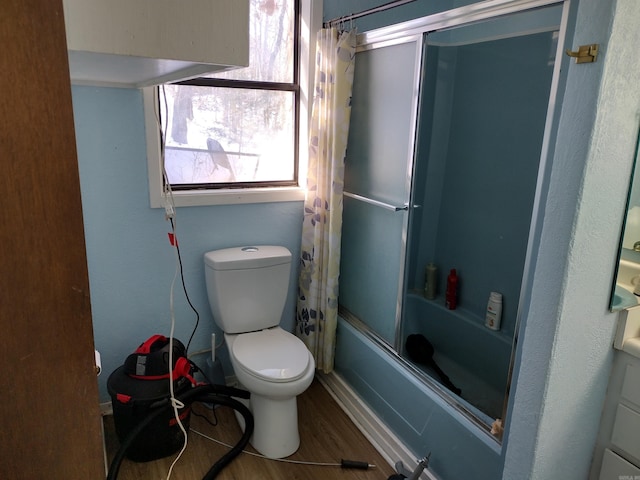 full bathroom with toilet, vanity, shower / bath combo, and wood-type flooring