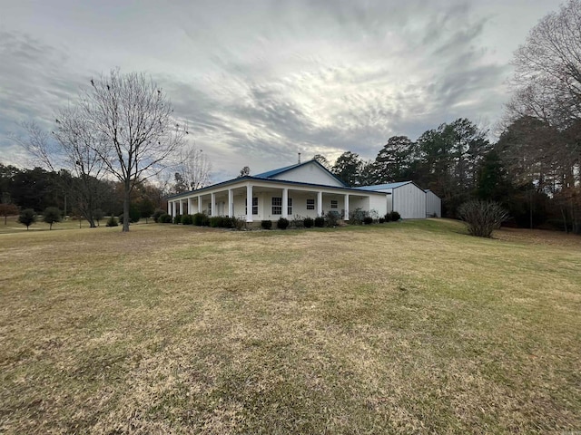 view of yard with covered porch