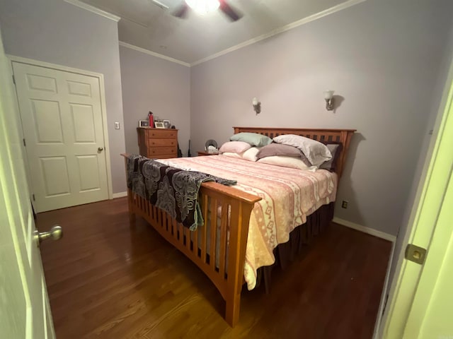 bedroom featuring ornamental molding, ceiling fan, and dark hardwood / wood-style floors