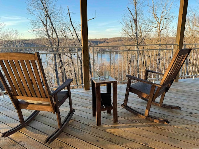 wooden deck with a water view