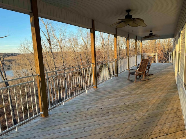 wooden deck featuring ceiling fan