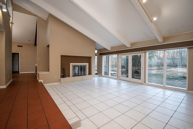 unfurnished living room with beam ceiling, high vaulted ceiling, a fireplace, and light tile flooring