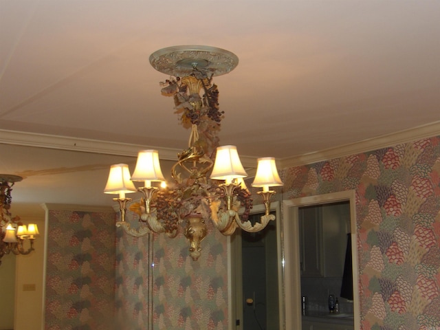 interior details with a chandelier and ornamental molding