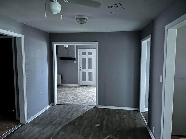 spare room featuring dark wood-type flooring