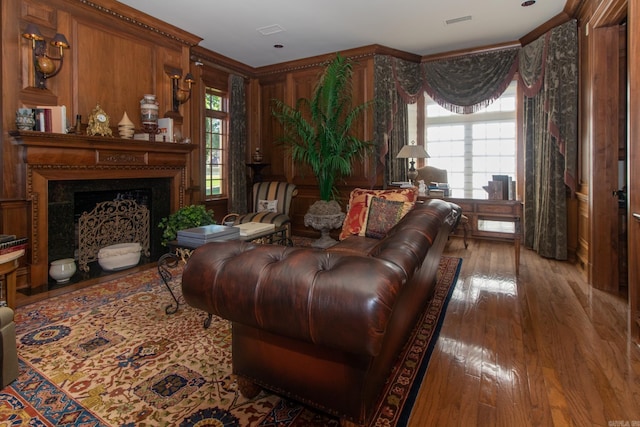 living room featuring crown molding and hardwood / wood-style floors