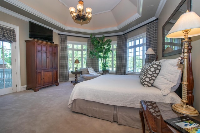 carpeted bedroom featuring a notable chandelier, a raised ceiling, multiple windows, and access to outside