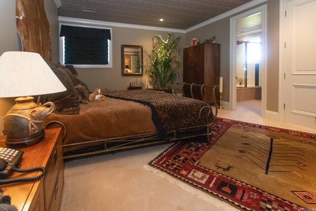 carpeted bedroom with connected bathroom and ornamental molding