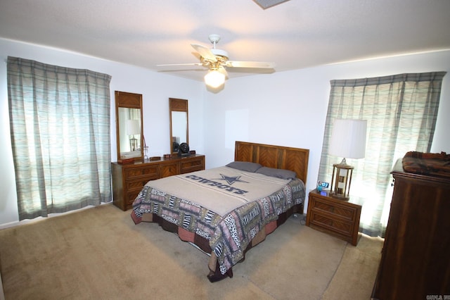 carpeted bedroom with ceiling fan