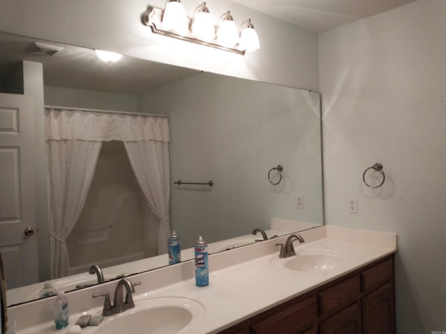 bathroom with dual bowl vanity