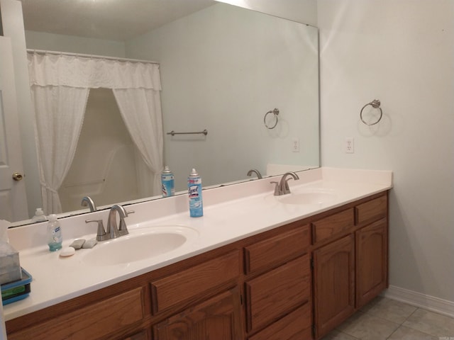 bathroom with double sink vanity and tile flooring