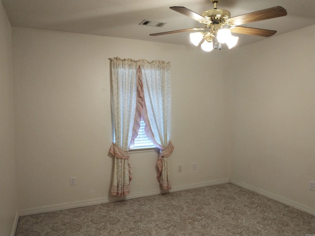 carpeted empty room with ceiling fan