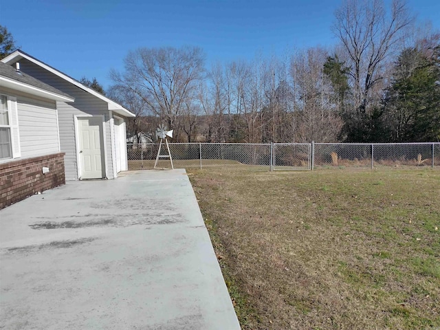 view of yard featuring an outdoor structure and a patio