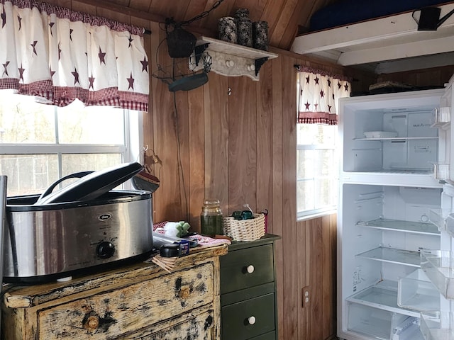 misc room with wooden walls, wood ceiling, and lofted ceiling