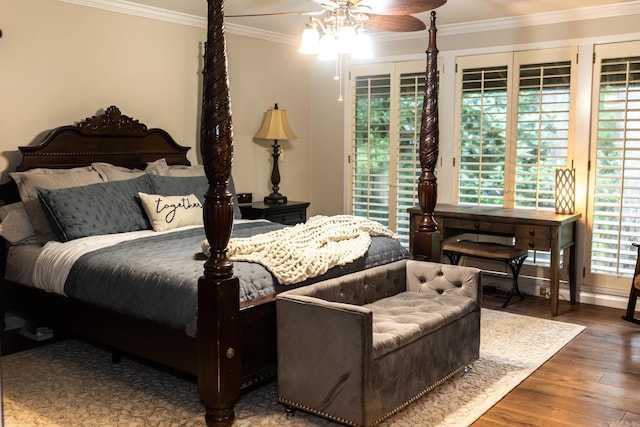 bedroom with ceiling fan, crown molding, and hardwood / wood-style flooring