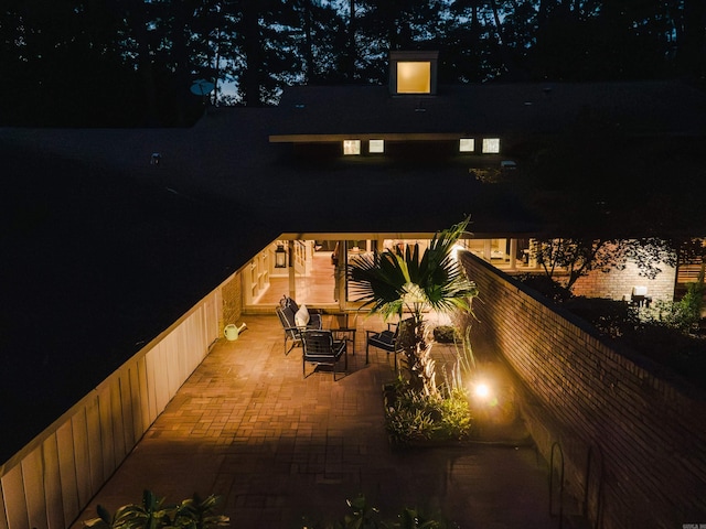 patio at twilight with a fire pit