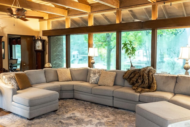 living room featuring beam ceiling and ceiling fan