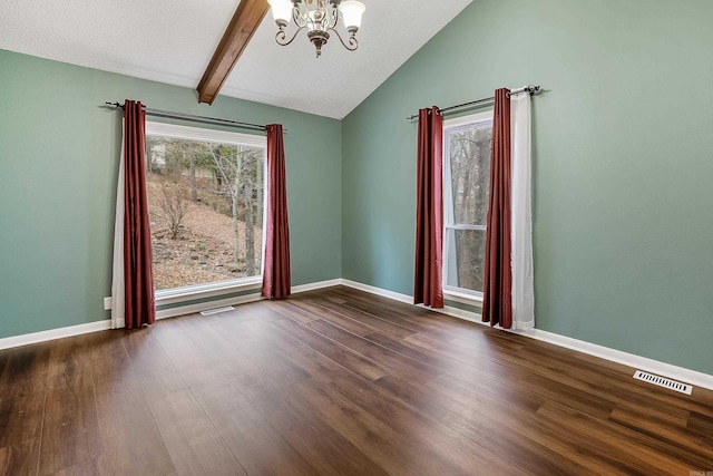 unfurnished room with lofted ceiling with beams, a textured ceiling, dark hardwood / wood-style floors, and a chandelier