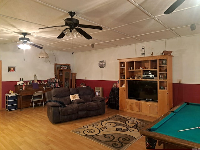 rec room featuring pool table, wood finished floors, a wainscoted wall, and a ceiling fan