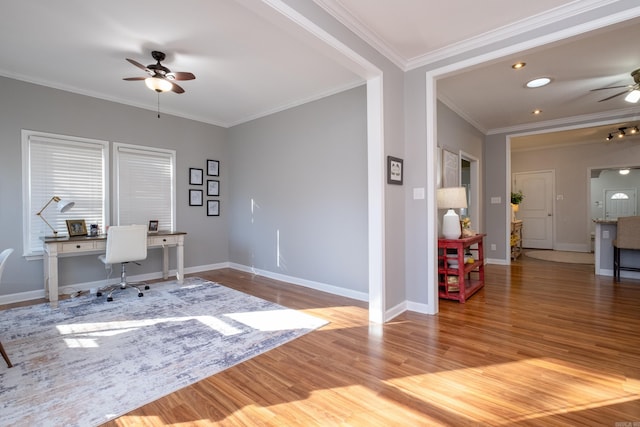 office with ornamental molding, ceiling fan, and light wood-type flooring