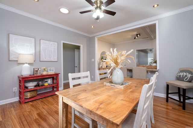 dining room featuring crown molding, ceiling fan, and hardwood / wood-style flooring