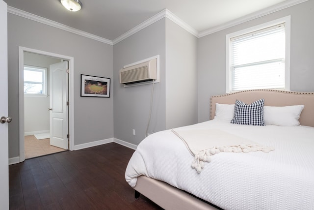 bedroom featuring crown molding, dark hardwood / wood-style floors, and a wall mounted AC