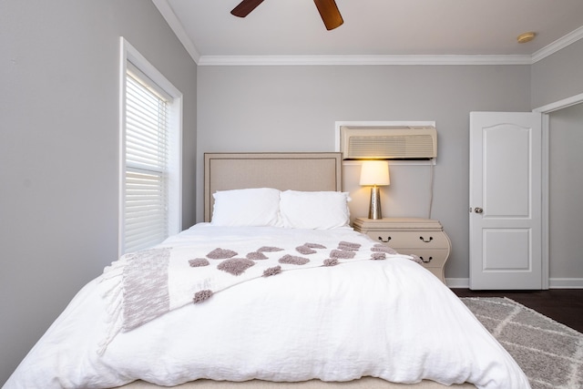 bedroom featuring ceiling fan, dark hardwood / wood-style floors, and crown molding