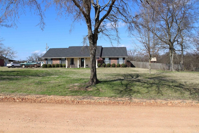 ranch-style home with a front yard