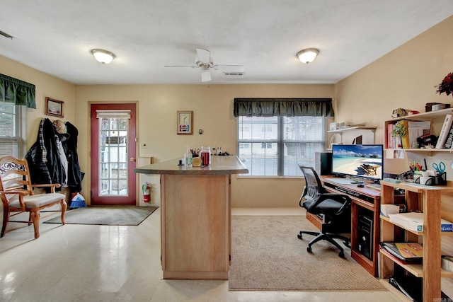 home office featuring ceiling fan and light tile floors