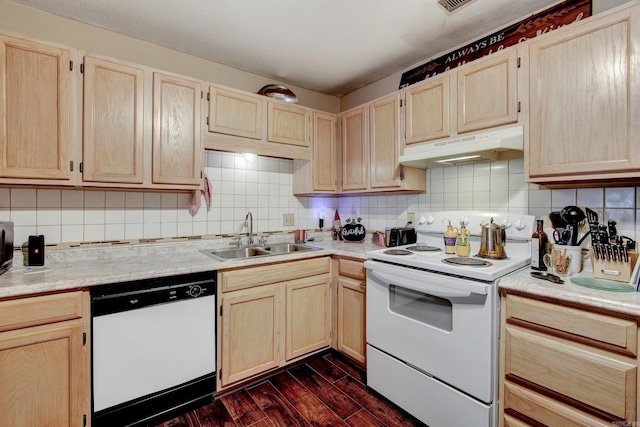 kitchen with backsplash, dark hardwood / wood-style floors, white appliances, and sink