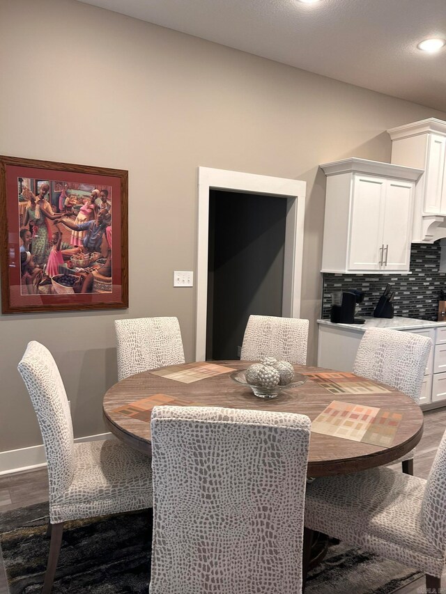 dining space featuring dark hardwood / wood-style flooring