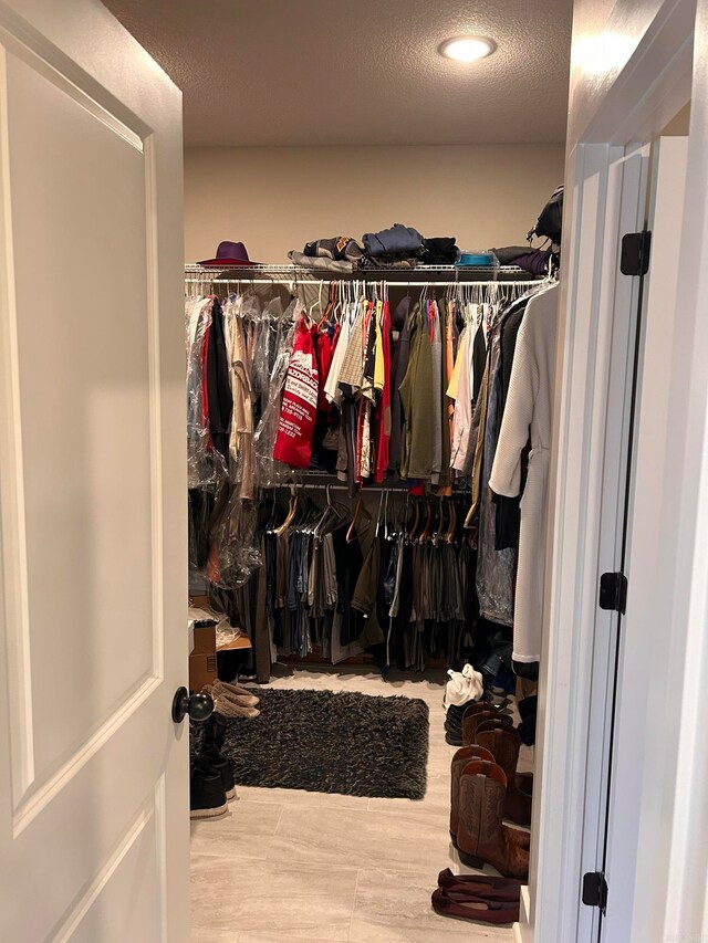 spacious closet featuring hardwood / wood-style flooring