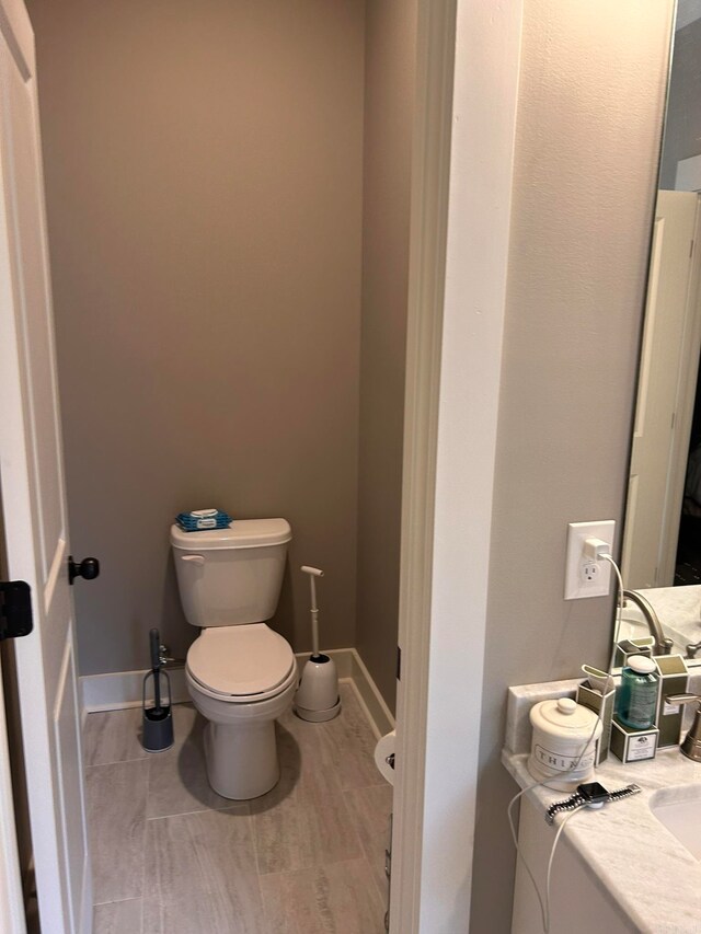 bathroom with toilet and vanity